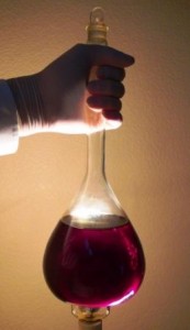 When held to a bright light, the characteristic violet tint is seen. This indicates the C60 is completely dissolved and near the saturation point.
